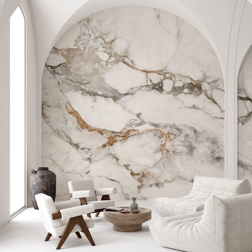 Floor-to-ceiling veined marble feature wall in an arched living room