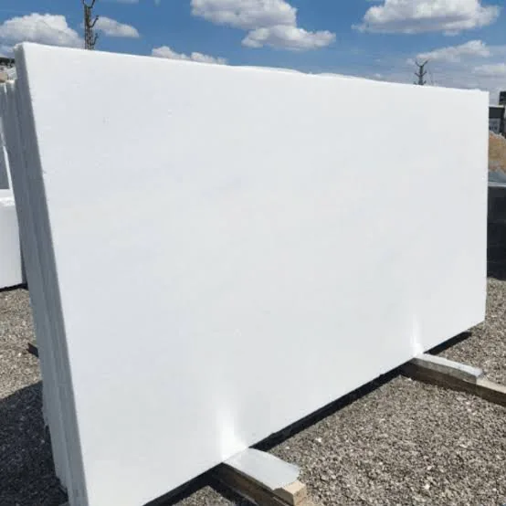 Slab of pure white Vietnamese marble standing in a stone yard