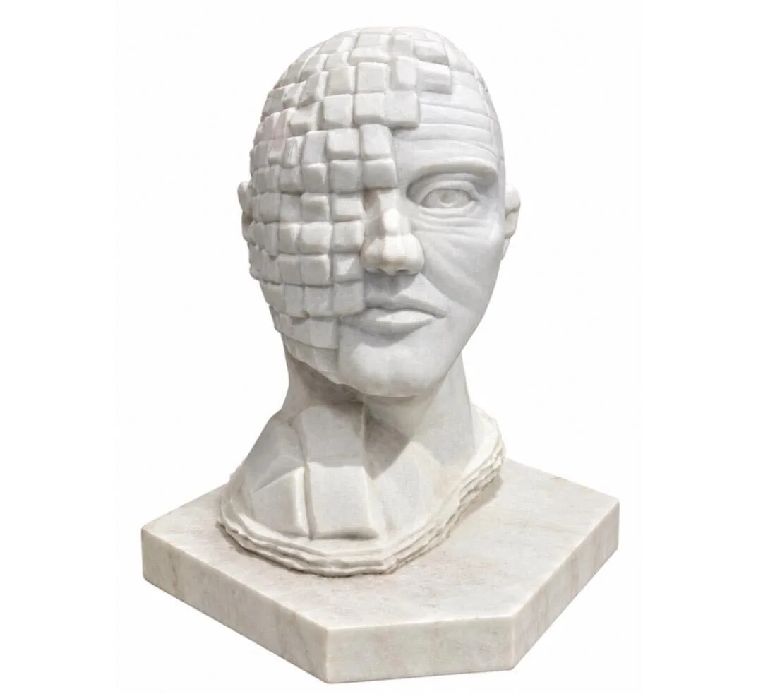 White marble head, half carved as a lifelike face and half dissolving into pixel-like cubes